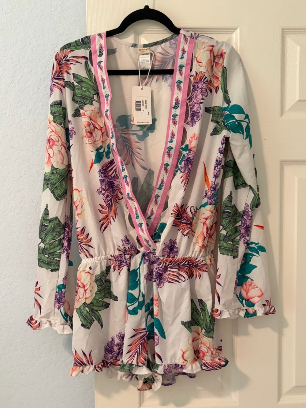 Agua Bendita Floral Deep V Romper with drop waist.